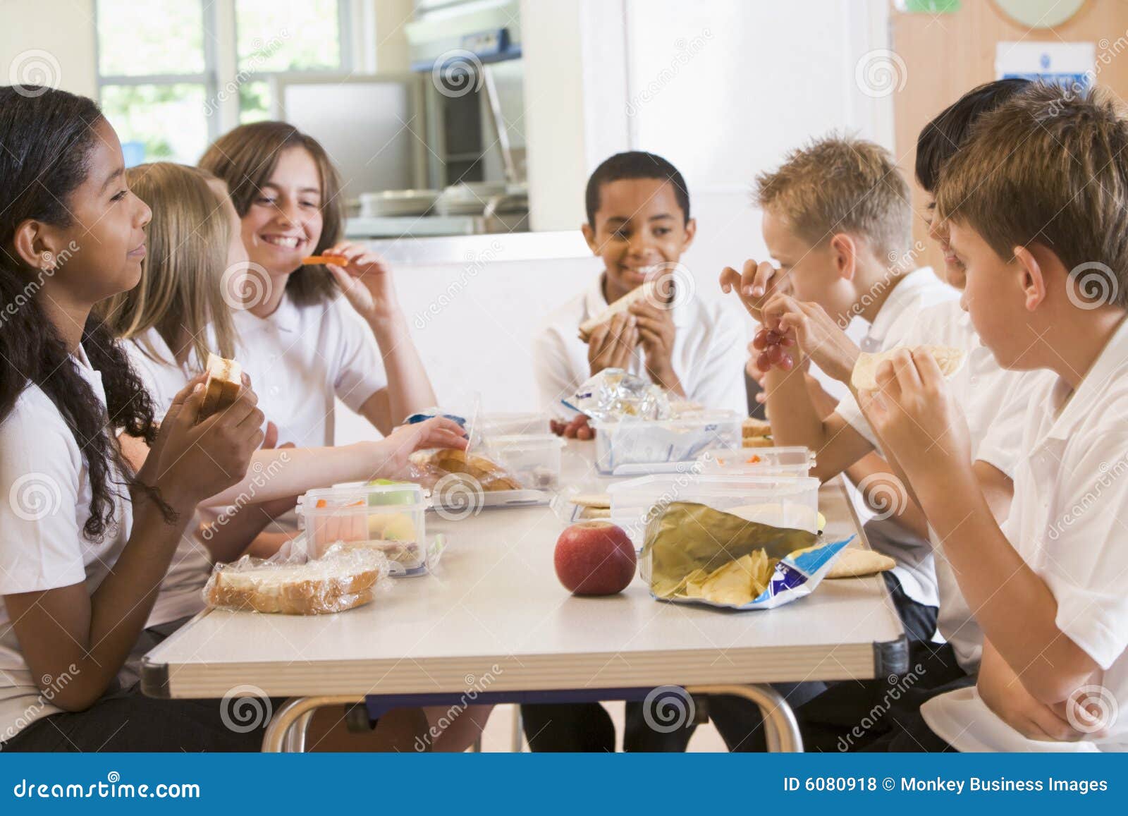 Schoolchildren Enjoying Their Lunch In School Stock Photo Image Of