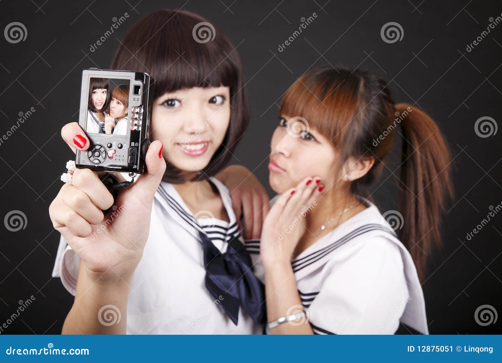 schoolgirls taking self-portrait