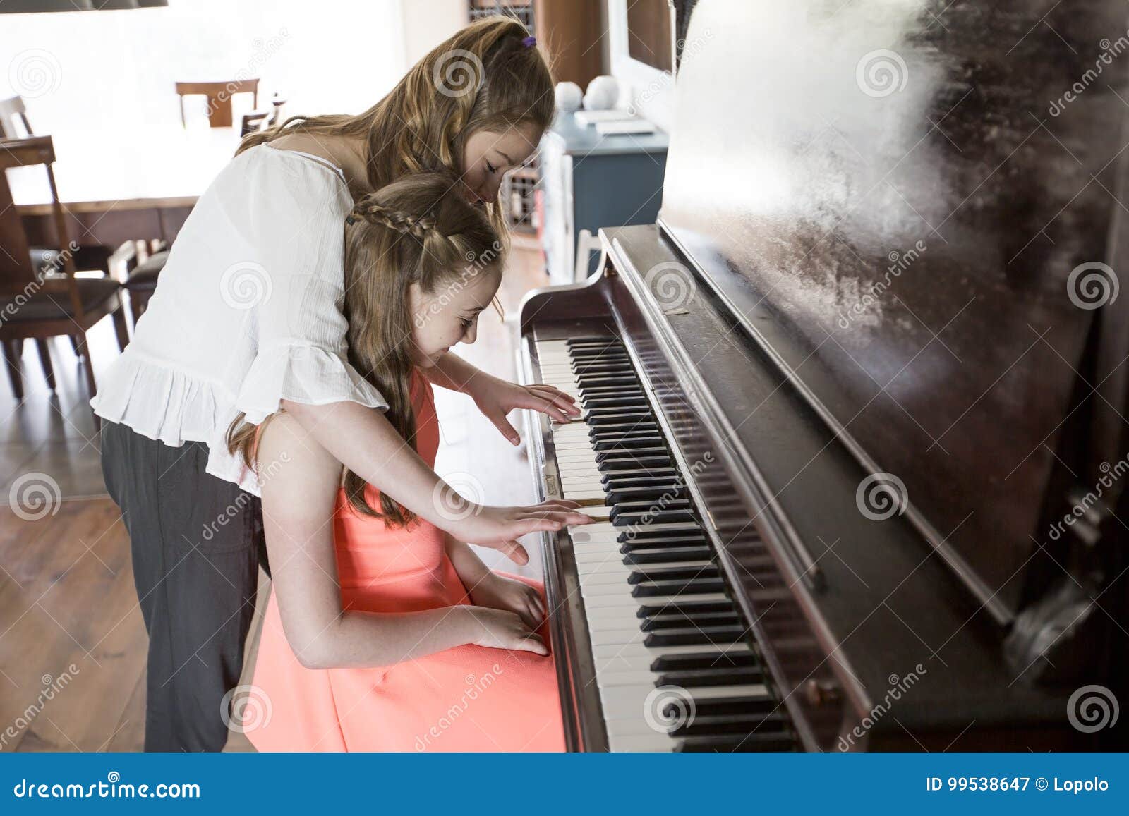 Sister play piano