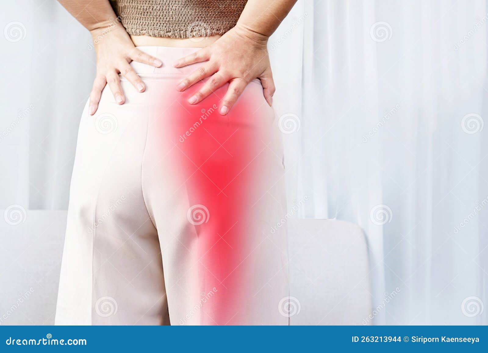 sciatica pain concept with woman suffering from buttock pain spreading to down leg