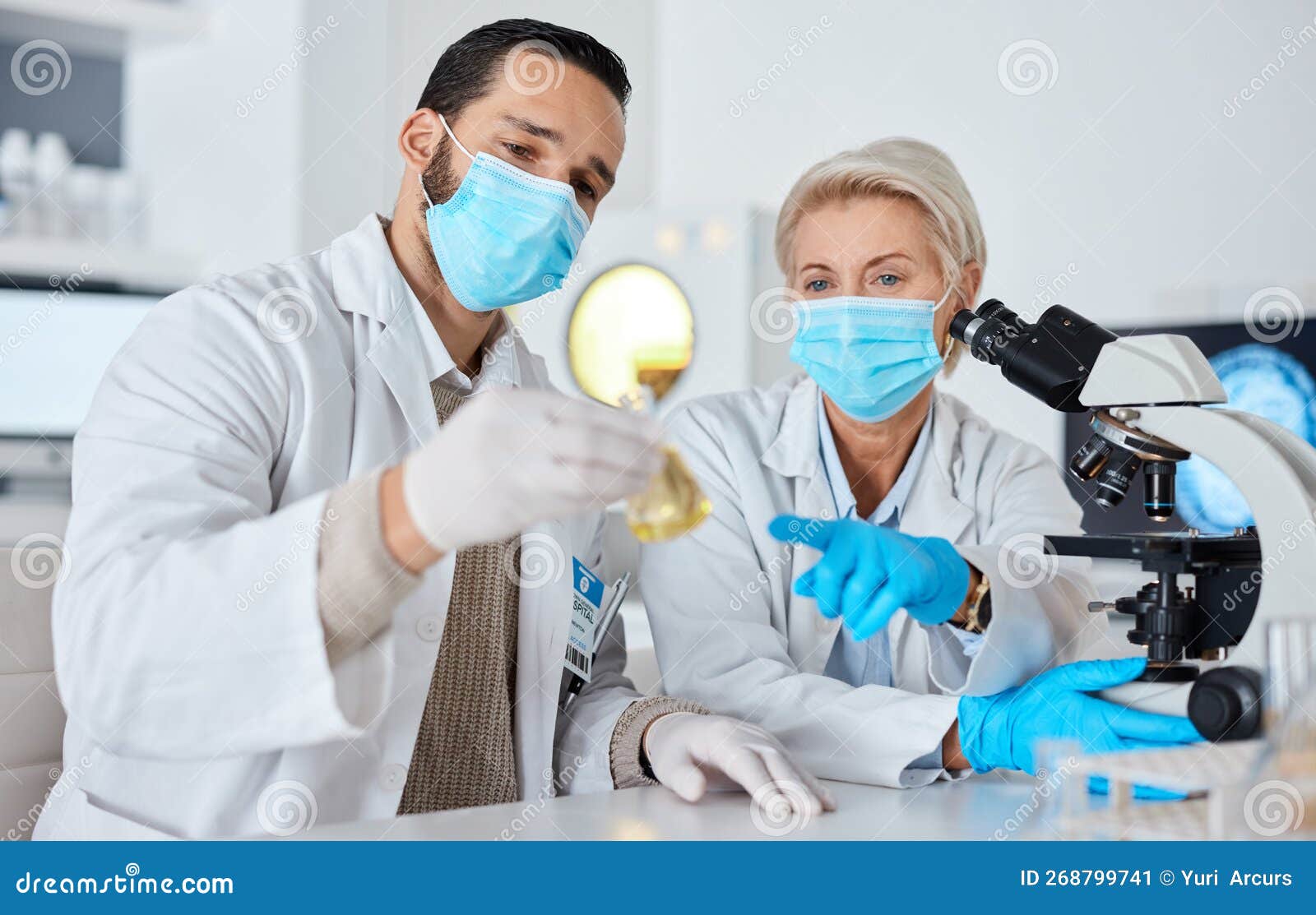 Science, Glass Beaker and Team of Scientists Working in a Laboratory