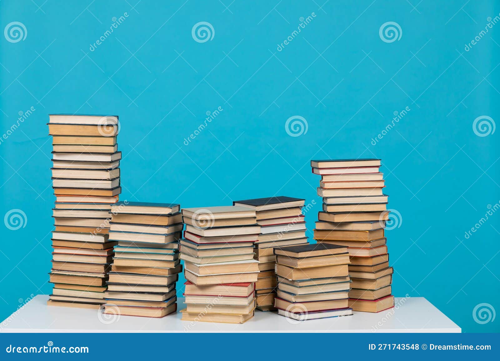 Science Reading a Lot of Books on a Blue Background in the Library in