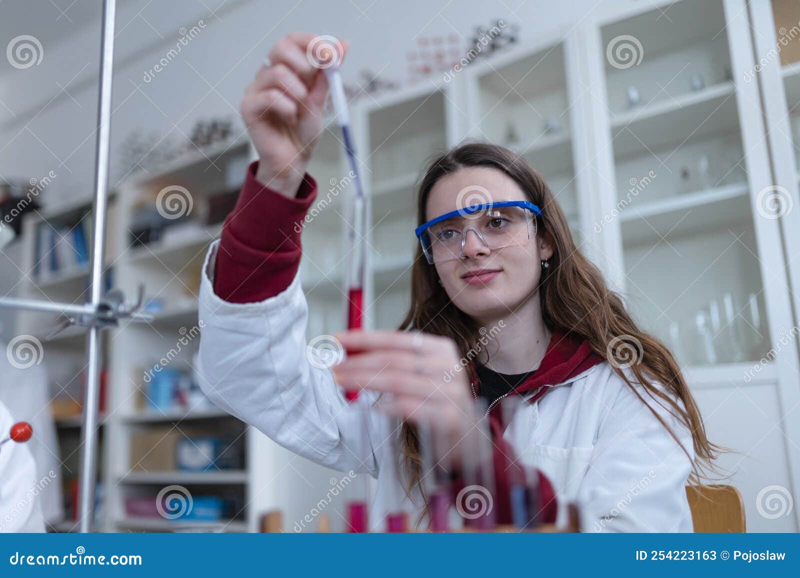 Science Students Doing Chemical Experiment in the Laboratory at