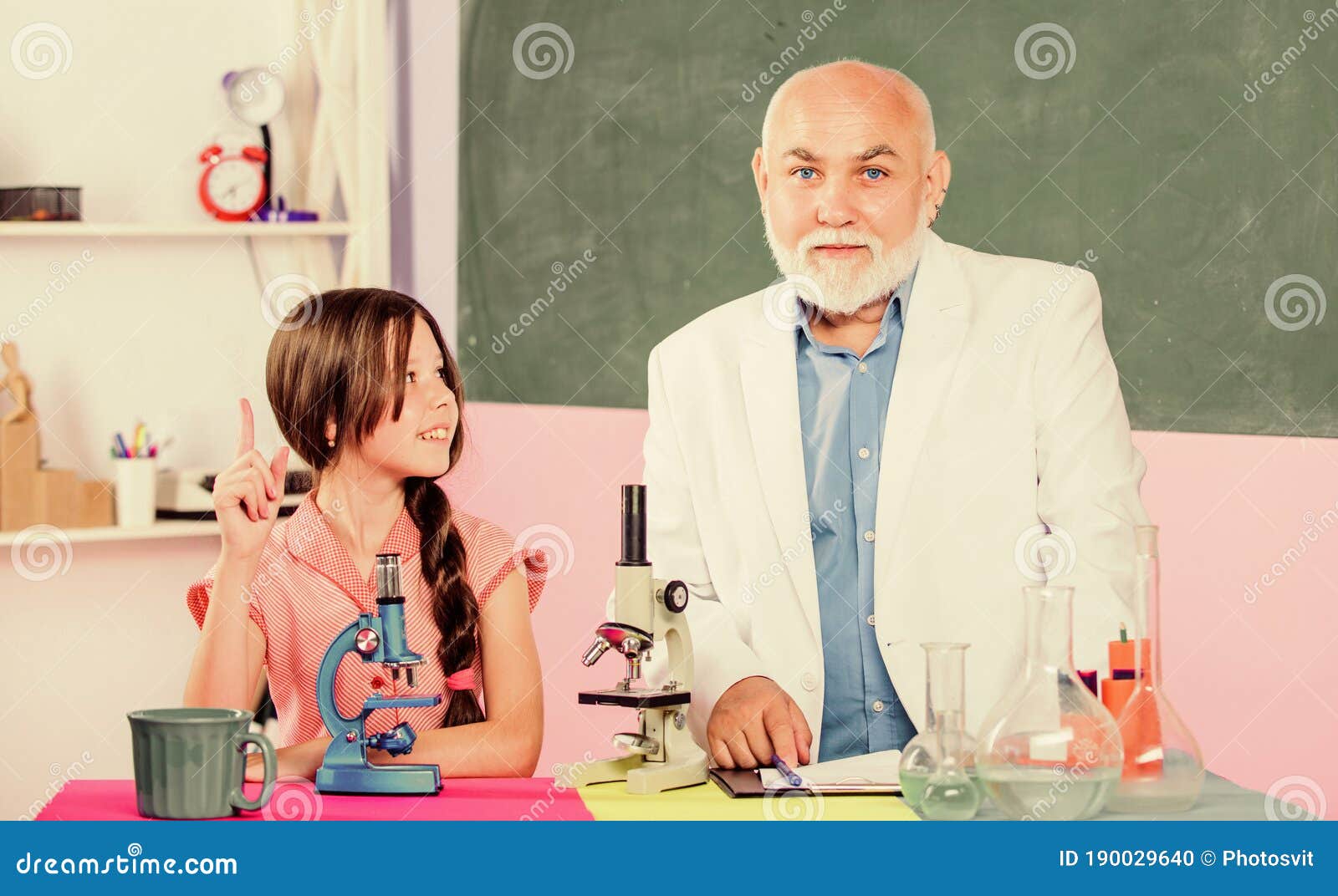 Scientific Biotechnology Research. Teacher of Biology. Pupil Girl in