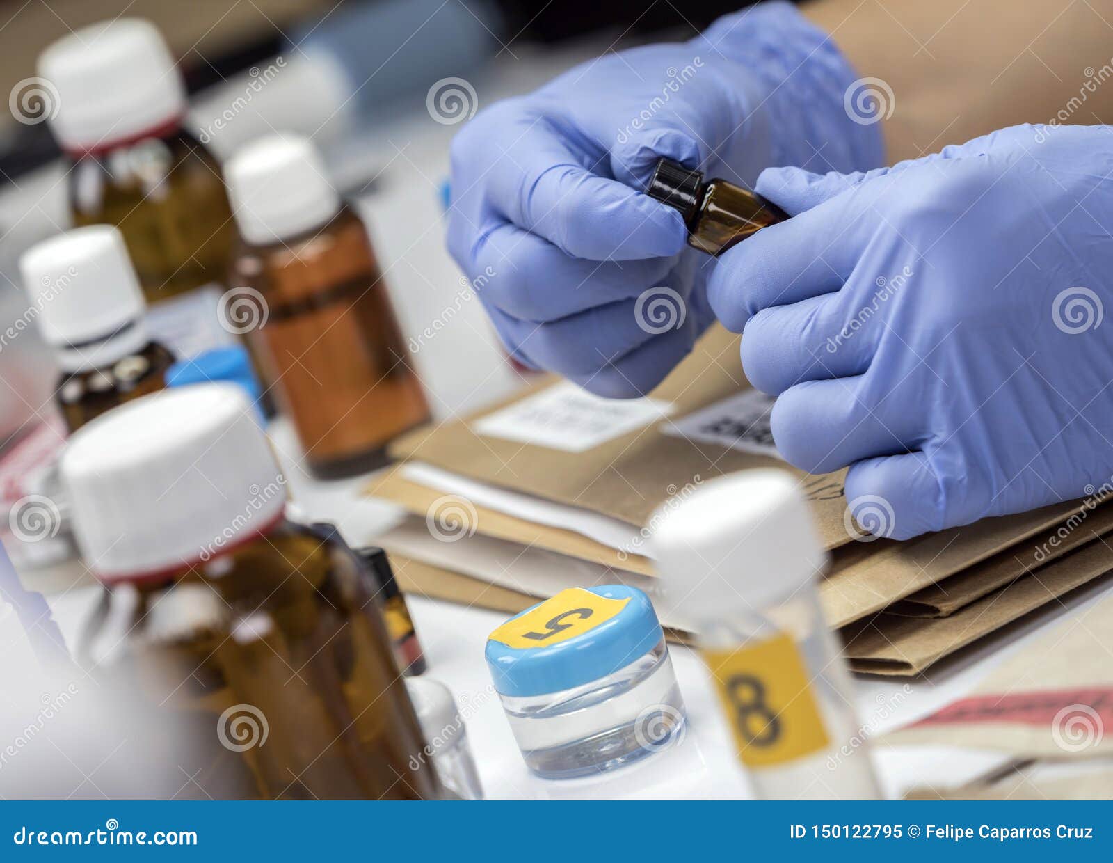 scientific police takes blood sample at laboratorio forensic equipment