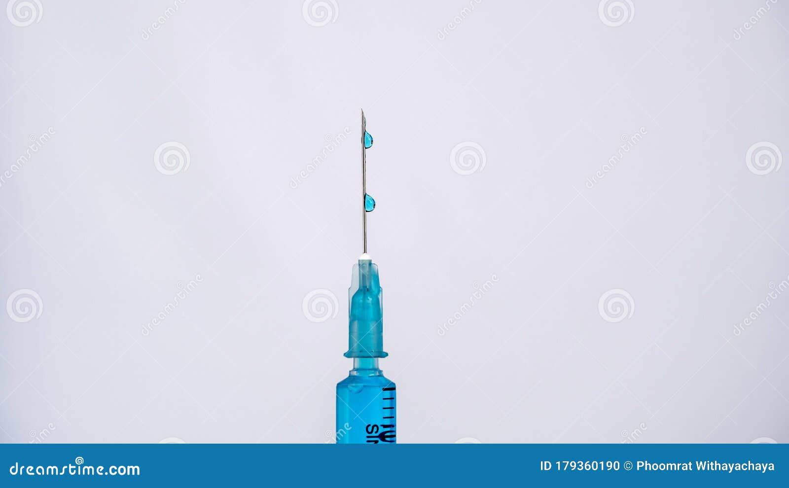 scientific researcher or doctor using syringe and vaccine in a laboratory with white background. a doctor filling vaccine to