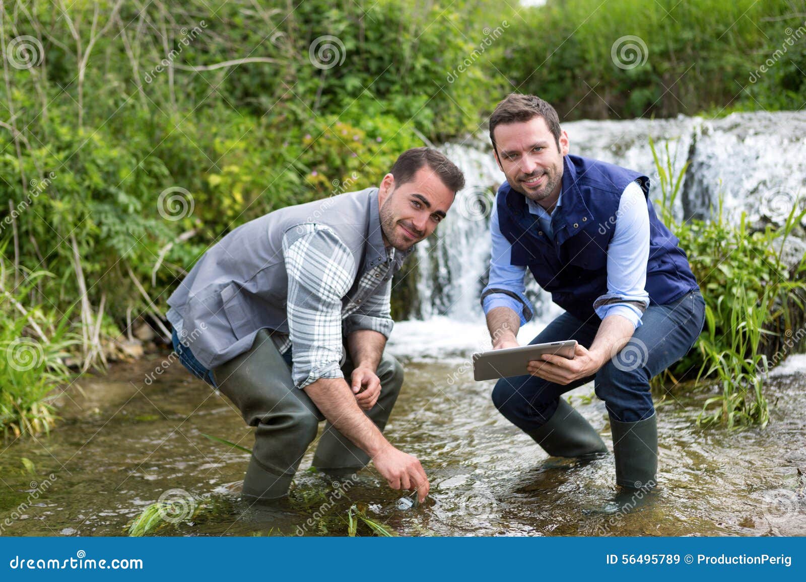 Scientist and Biologist Working Together on Water Analysis Stock Image