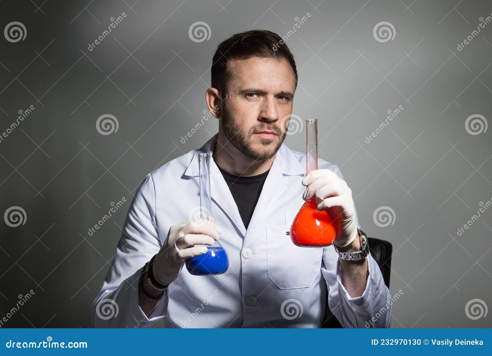 The Scientist Compares the Liquid in the Laboratory Stock Photo Image of master, expertise