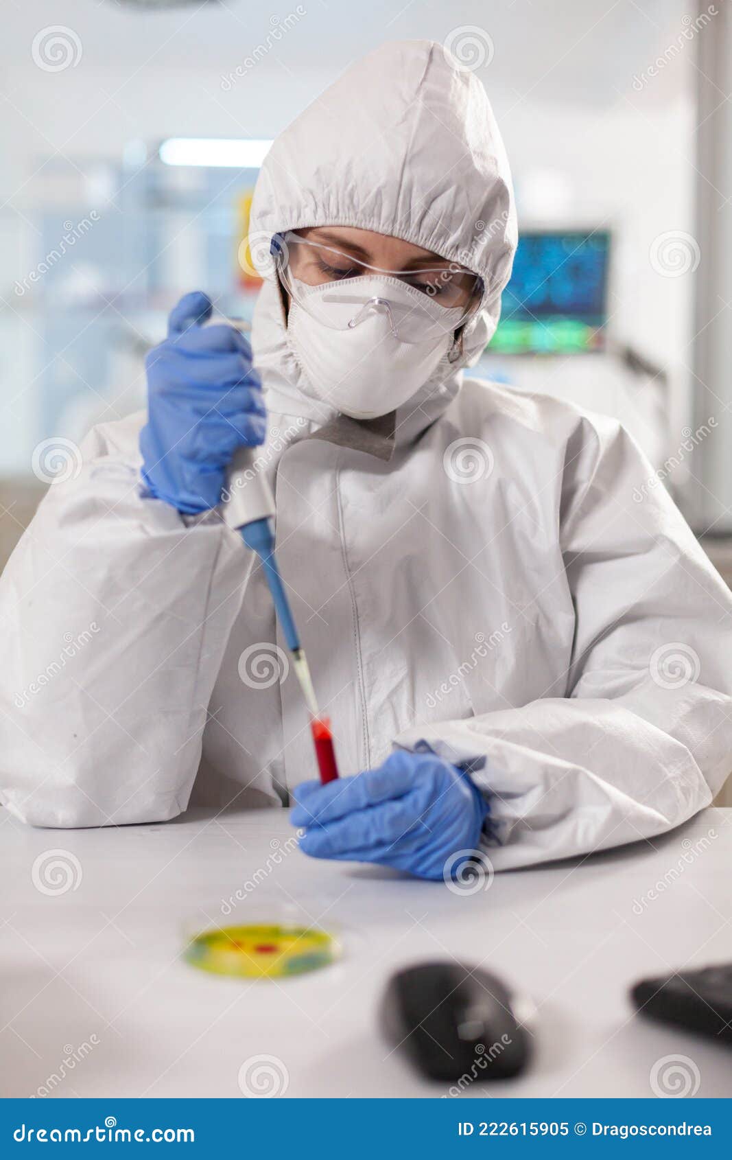 Scientist Dressed in Ppe Suit Taking Blood Sample Using Micropipette