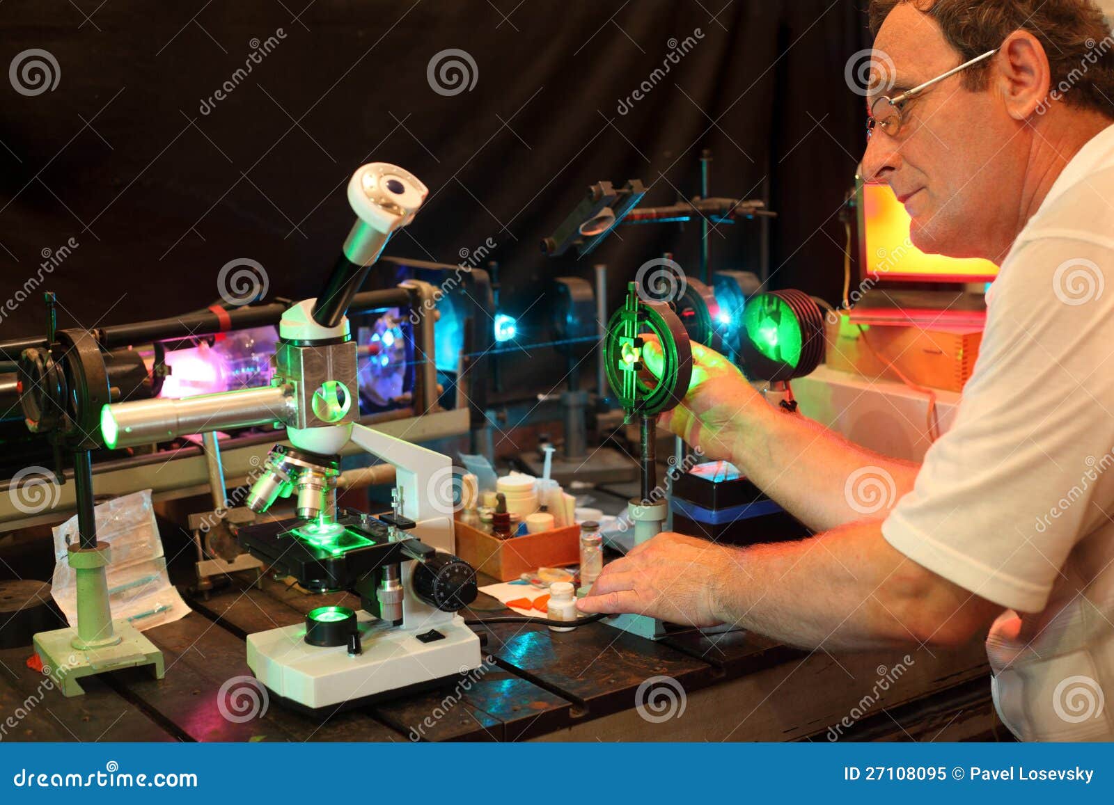 scientist with glass demonstrate laser