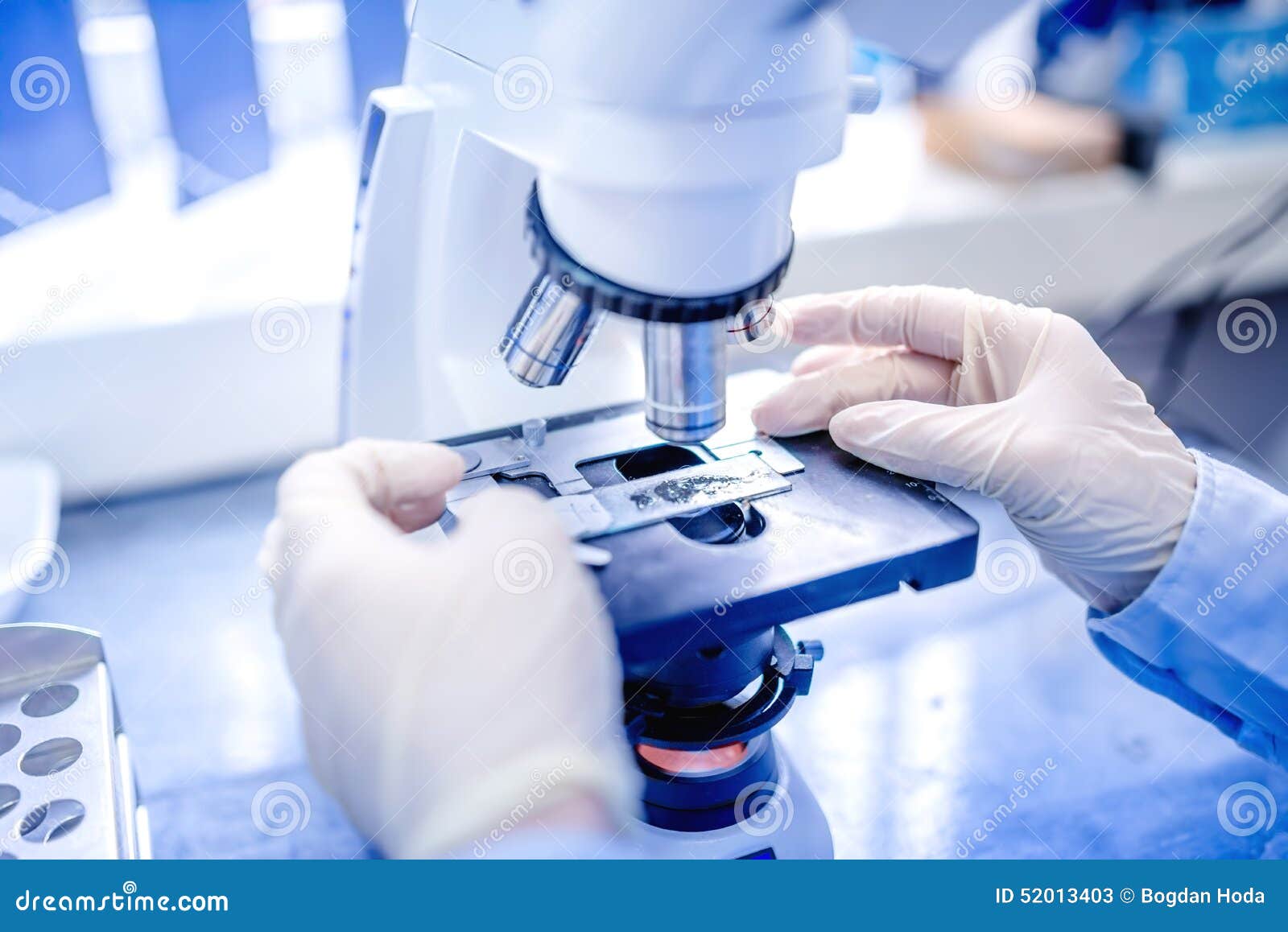 scientist hands with microscope, examining samples and liquid. medical research with technical equipment