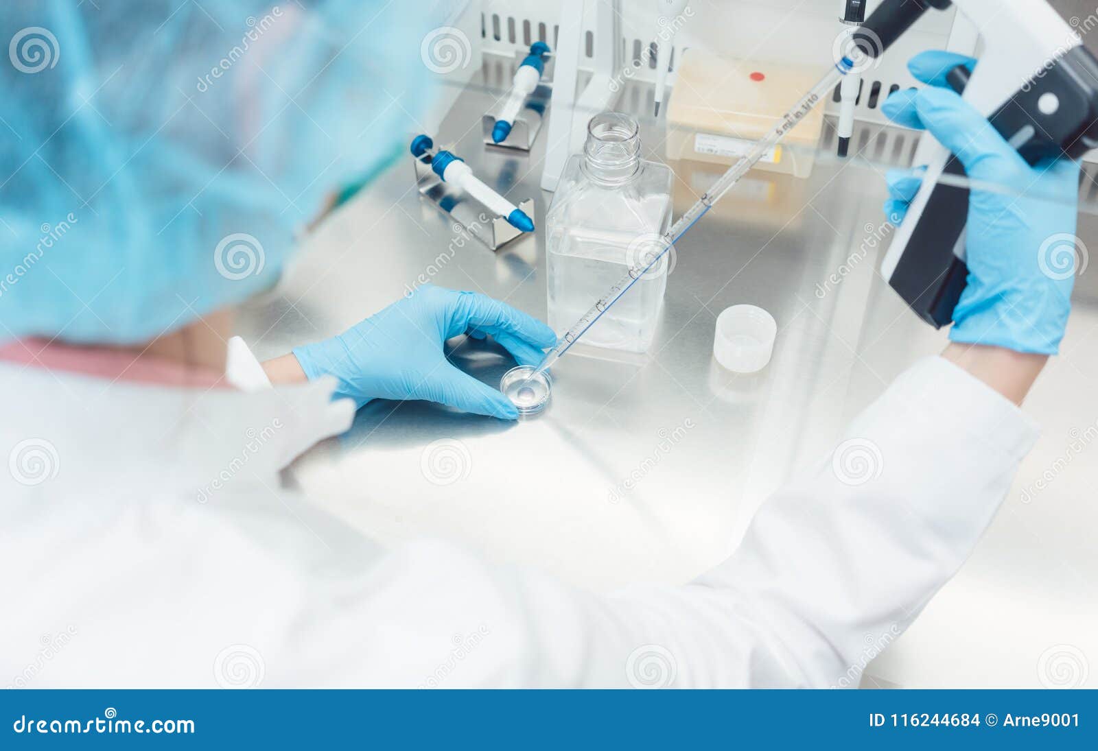 scientist in lab conducting biotechnological experiment