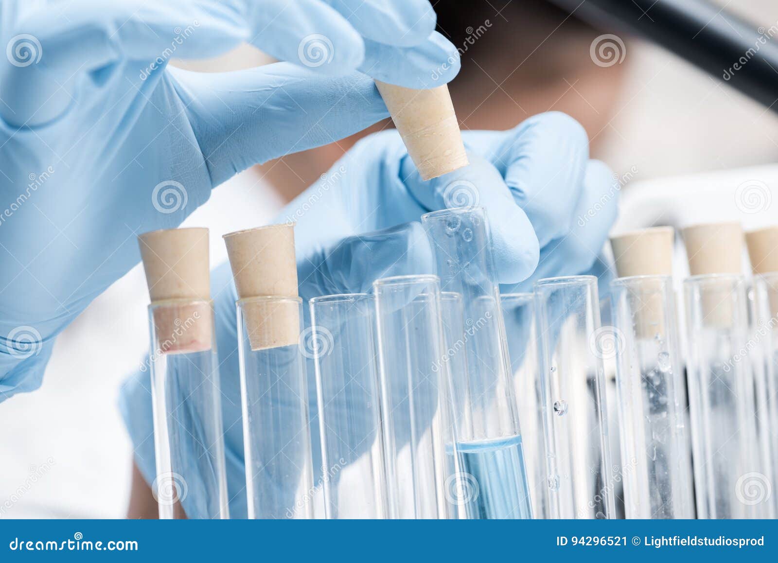 Scientist in Protective Gloves Working with Test Tubes in Chemical Lab