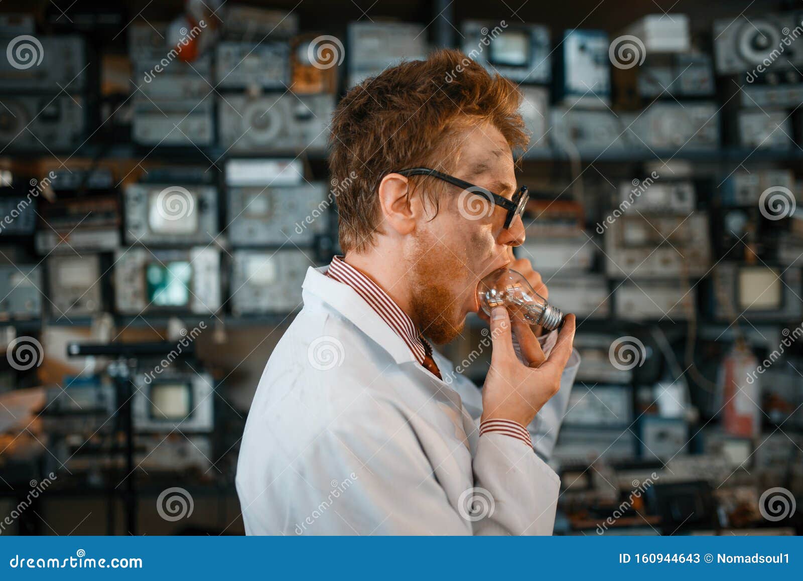 Scientist Trying To Put a Light Bulb in His Mouth Stock Image Image