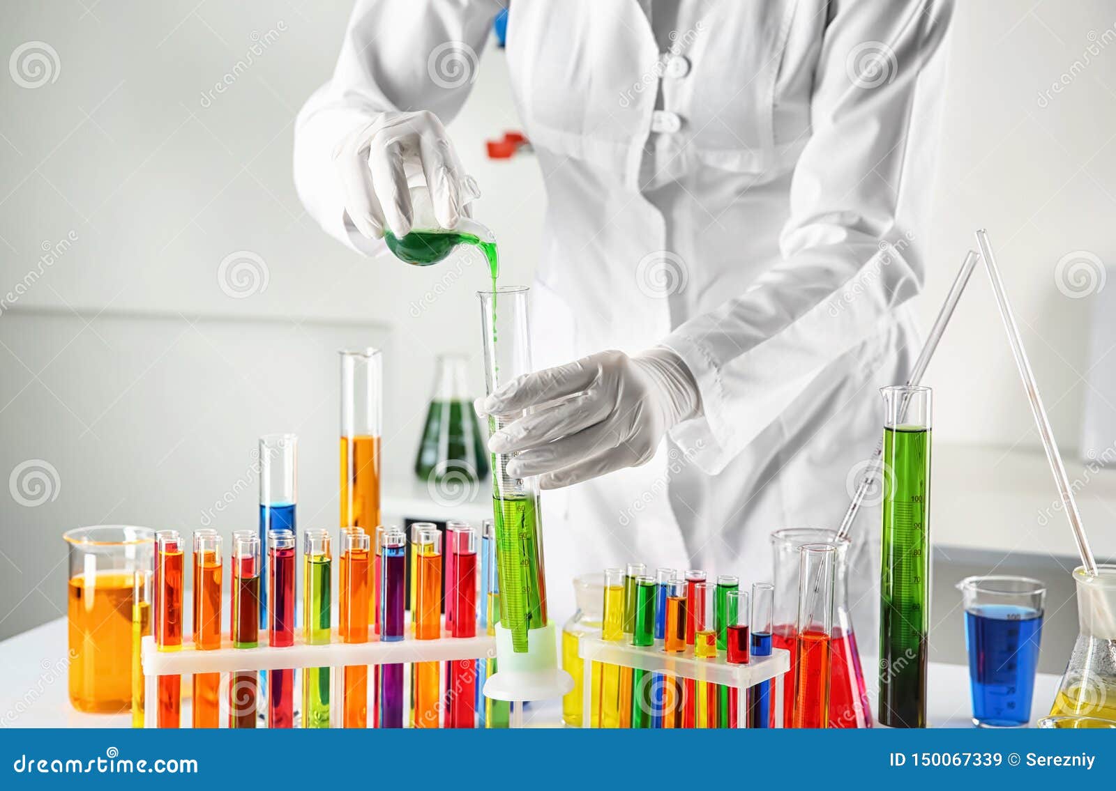 Scientist Working with Laboratory Glassware and Test Tubes on Table