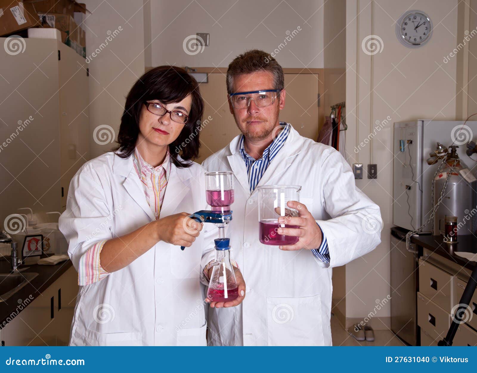 Scientists holding labware stock photo. Image of holding 27631040