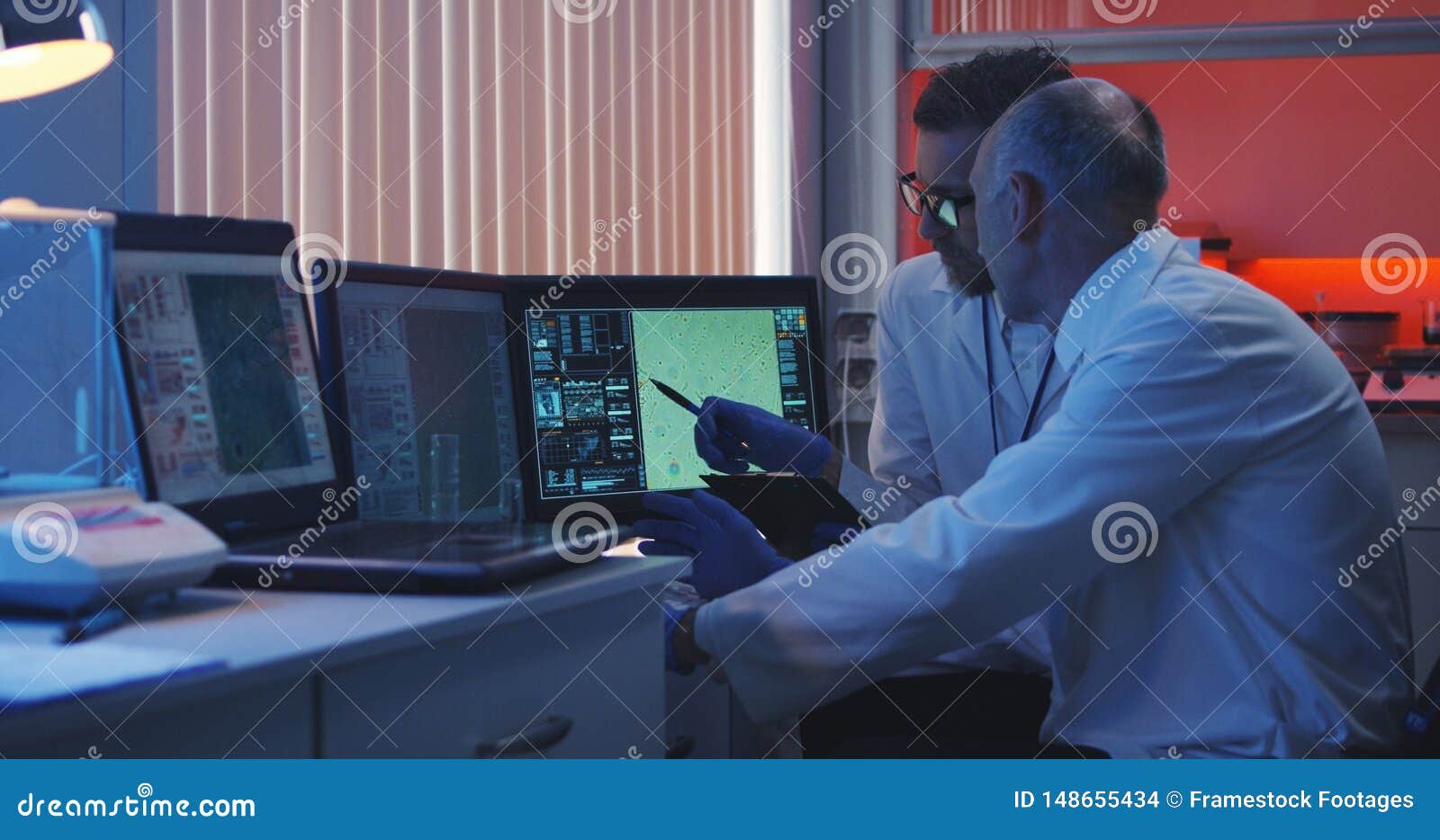 scientists watching monitor and analyzing