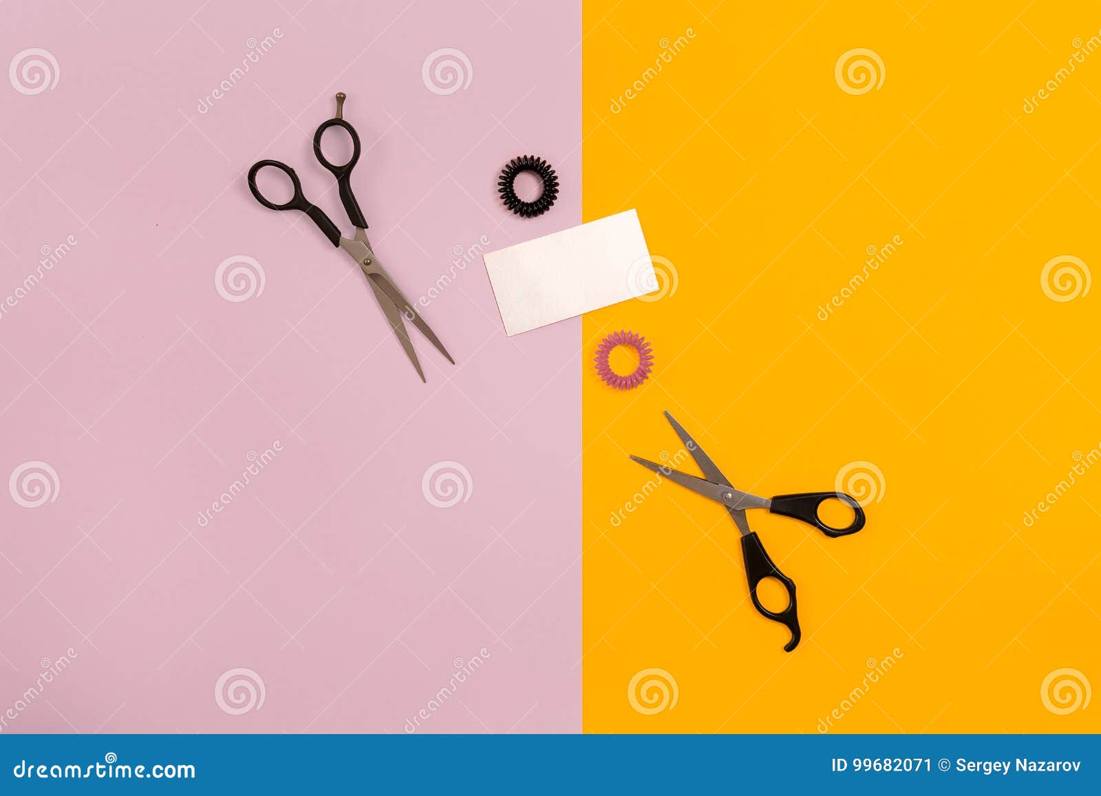 scissors on the color pink, yellow paper background. top view.