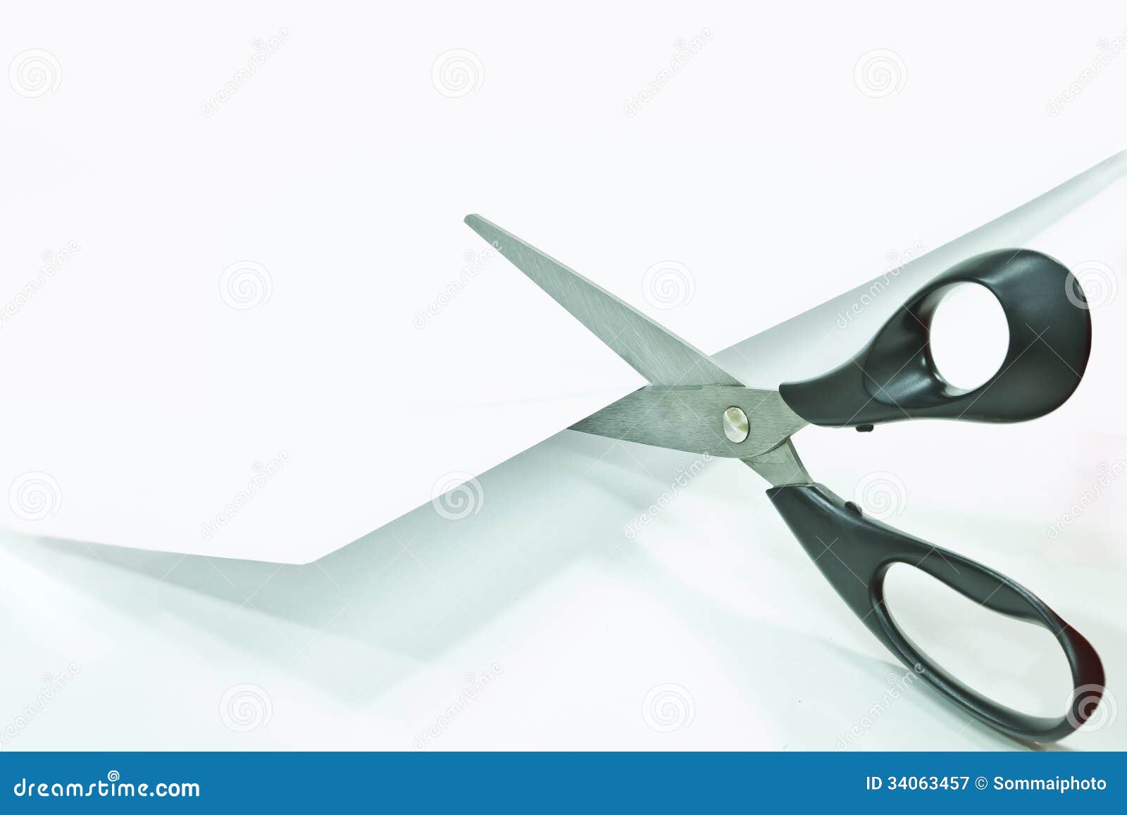 Cut Cardboard with Scissors Isolated on White Background Stock
