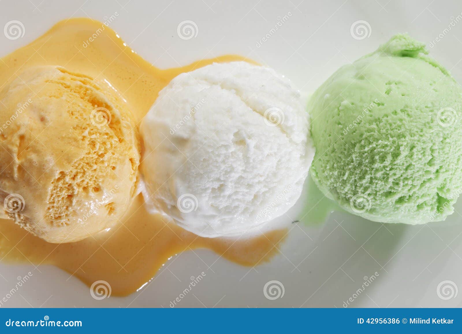 scoop of delicious real fresh ice cream in mango, vanilla and pistachio flavour.