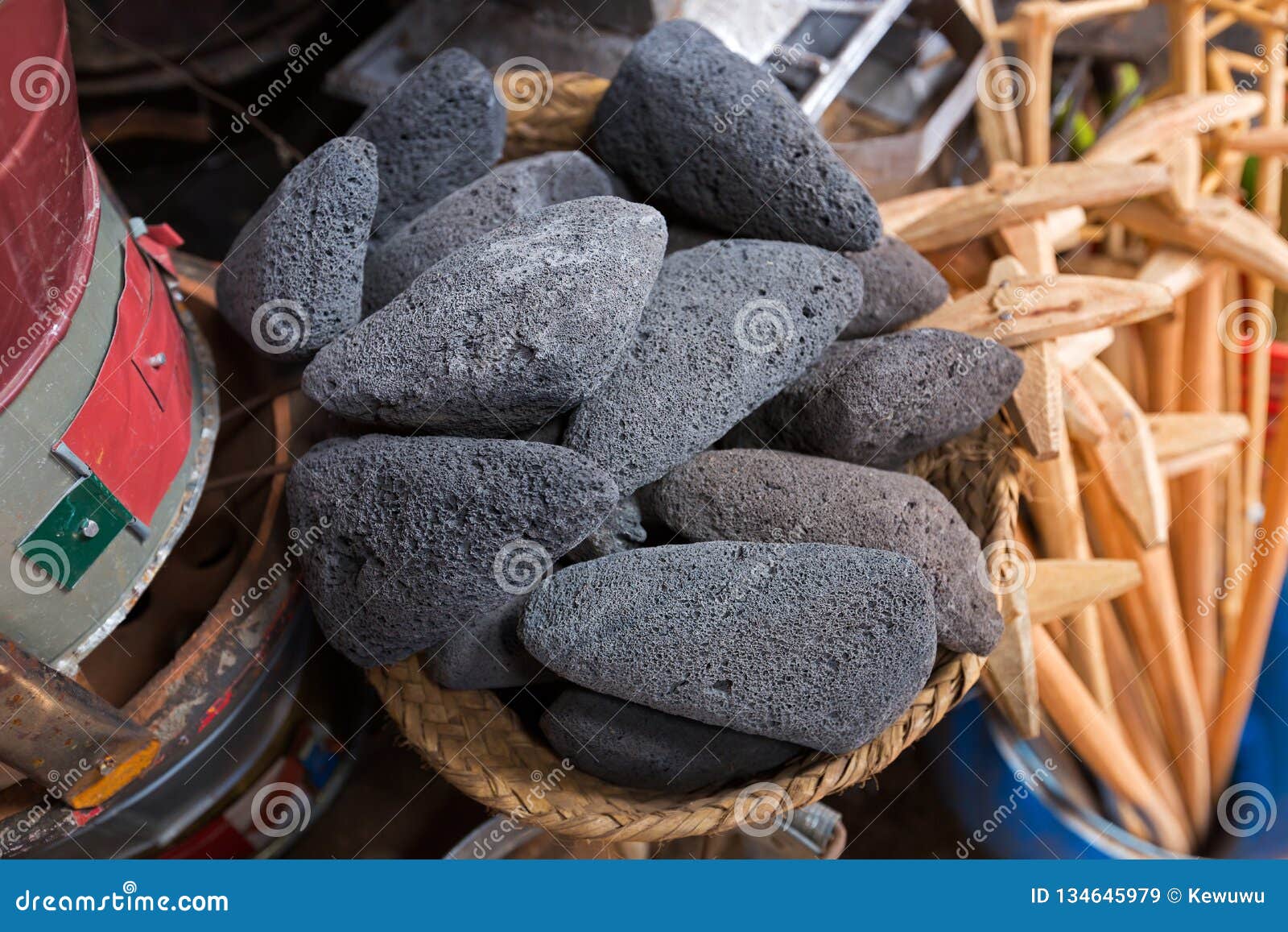 scoria stone, volcanic rock, black lava rough stones full of holes vesicles in dark color selling at mto wa mbu village, tanzania