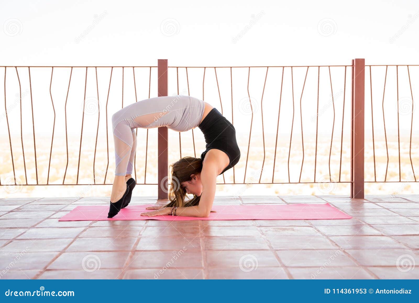 Beautiful sporty yogi girl practices yoga asana, Scorpion Pose  Vrischikasana, forearm stand, inverted backbend pose People Images |  Creative Market