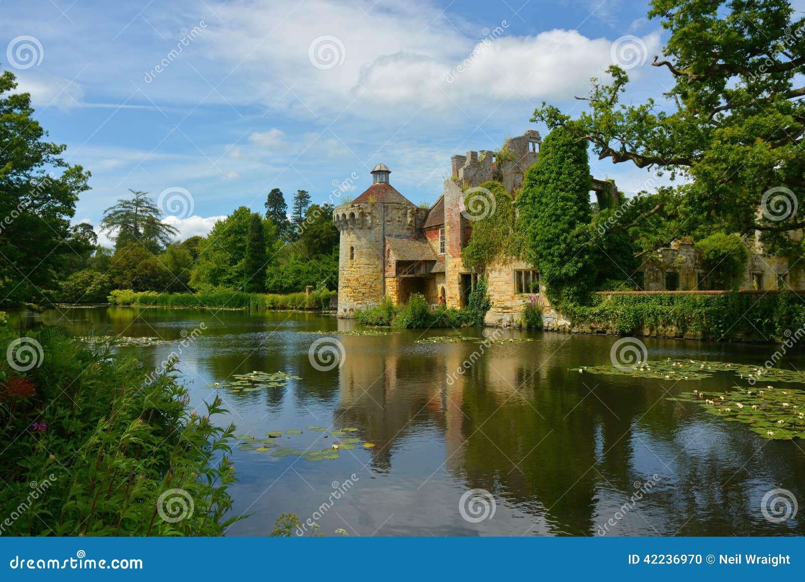 England s Beautiful Scotney Castle. Scotney Castle is a romantic 14th century part ruin in the heart of the Kent countryside in England, surrounded by a lake and wonderful scenic gardens