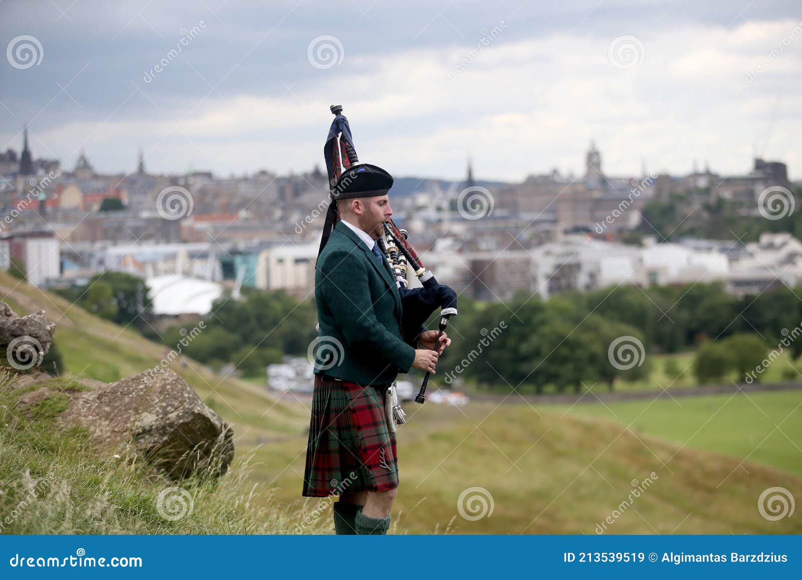 Scottish Bagpiper Playing Music with Bagpipe at Edinburgh in Scotland ...