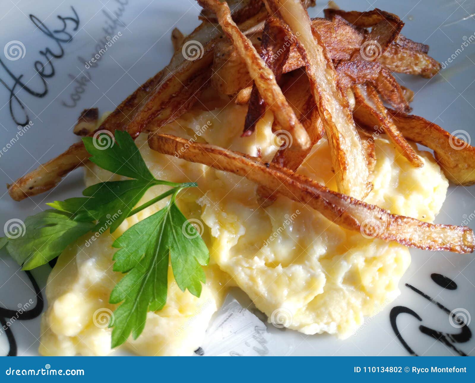 Scrambled eggs and chips stock photo. Image of thin 110134802