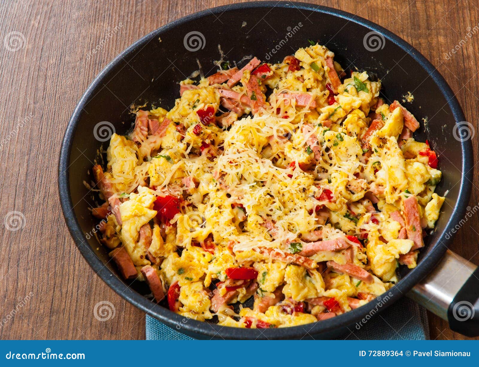 Scrambled Eggs with Ham, Vegetables and Cheese in a Frying Pan Stock