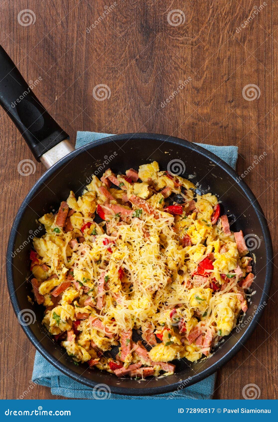 Scrambled Eggs with Ham, Vegetables and Cheese in a Frying Pan Stock