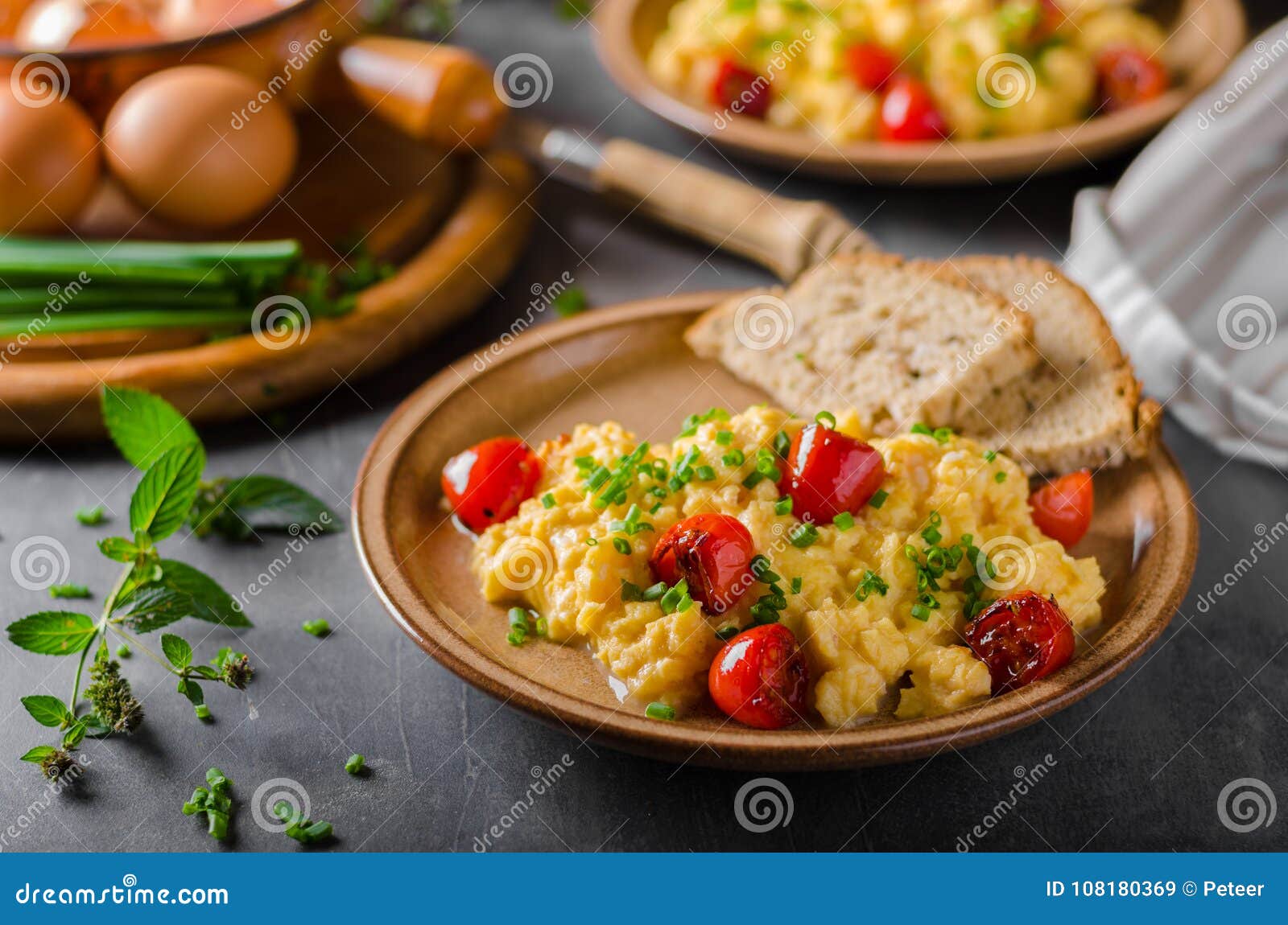 Scrambled eggs with herbs stock image. Image of background 108180369