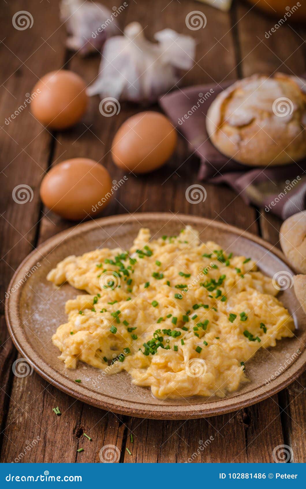 Scrambled eggs with herbs stock photo. Image of brown 102881486