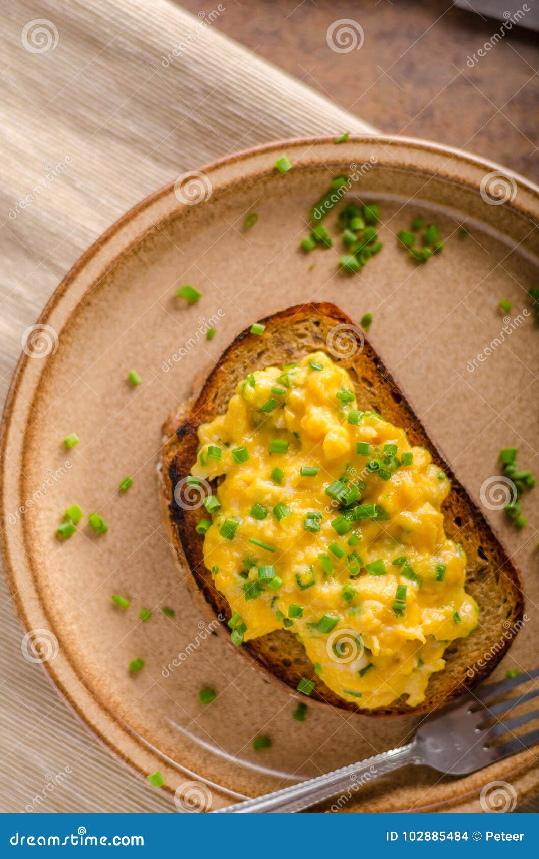 Scrambled eggs with herbs stock photo. Image of fork 102885484