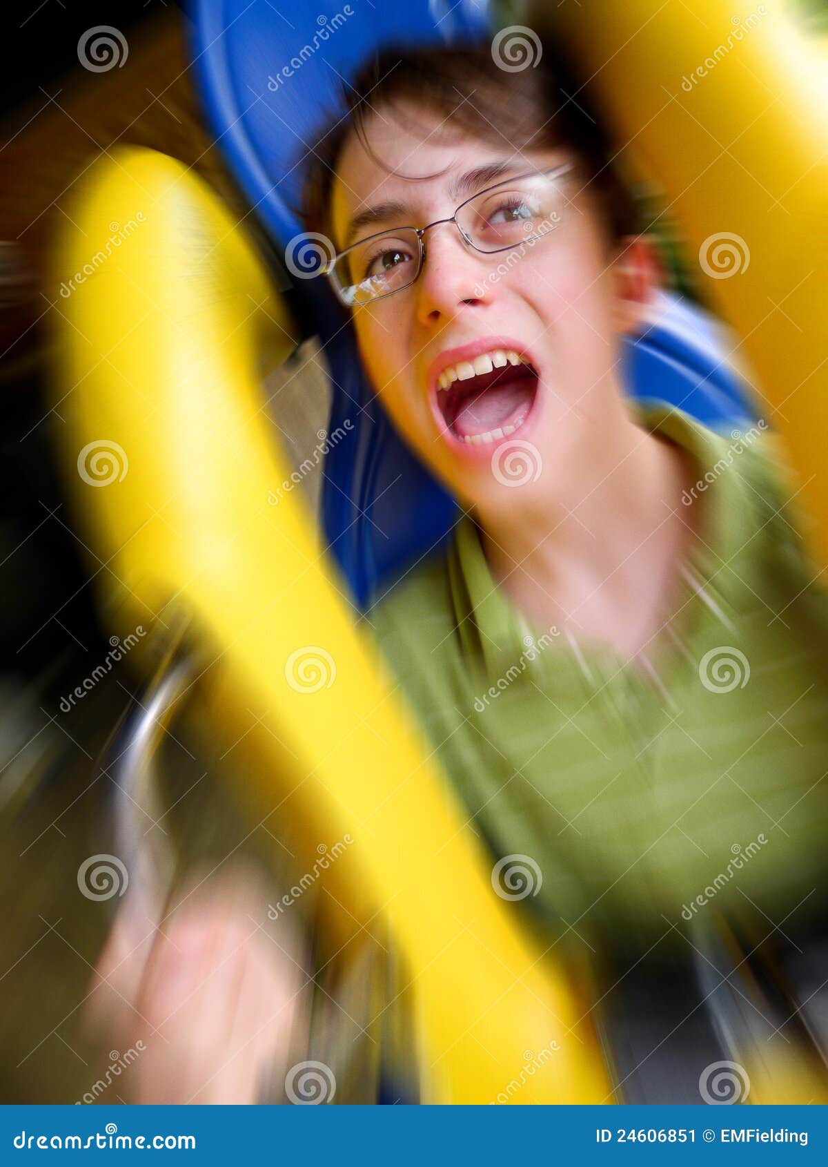 screaming boy riding on a roller coaster