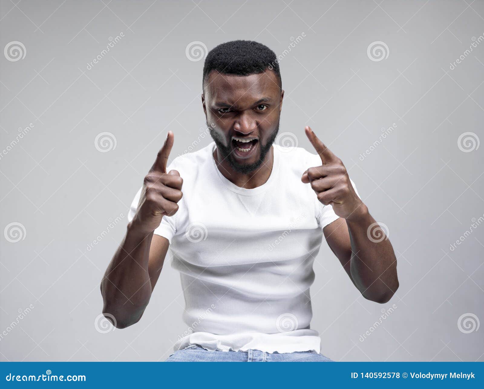 The Young Emotional Angry Man Screaming on Gray Studio Background Stock ...