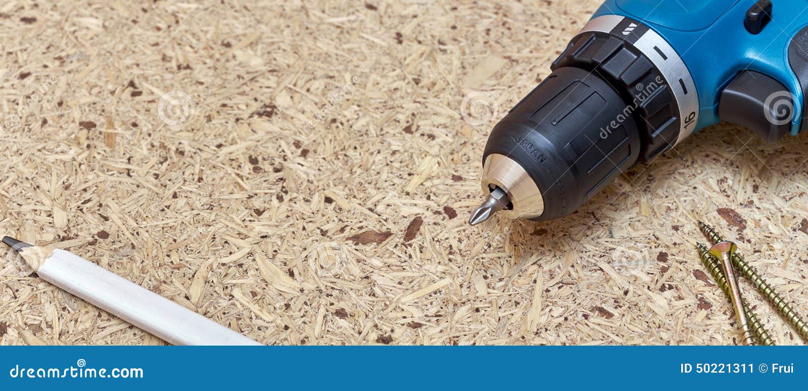 Screwdriver on chipboard stock image. Image of chipboard 50221311