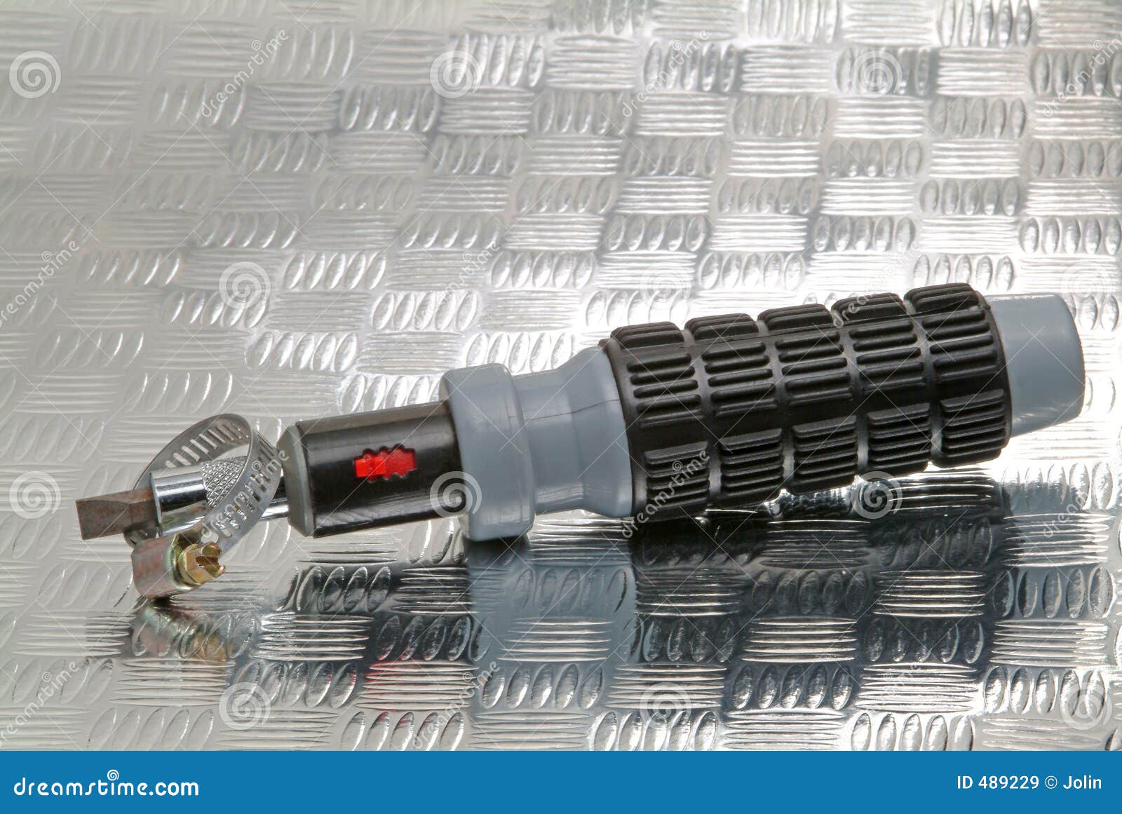 Screwdriver and hose clamp stock image. Image of bolt, grey 489229