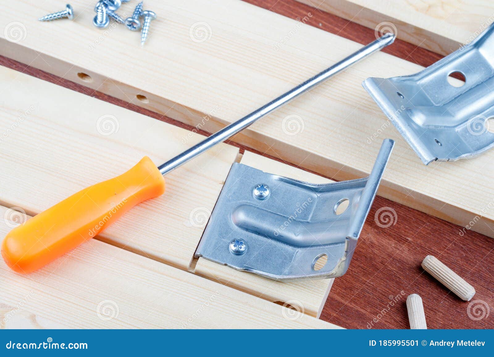 Screwdriver and Selftapping Screws with Metal Corner Elements for Assembling the Table Stock