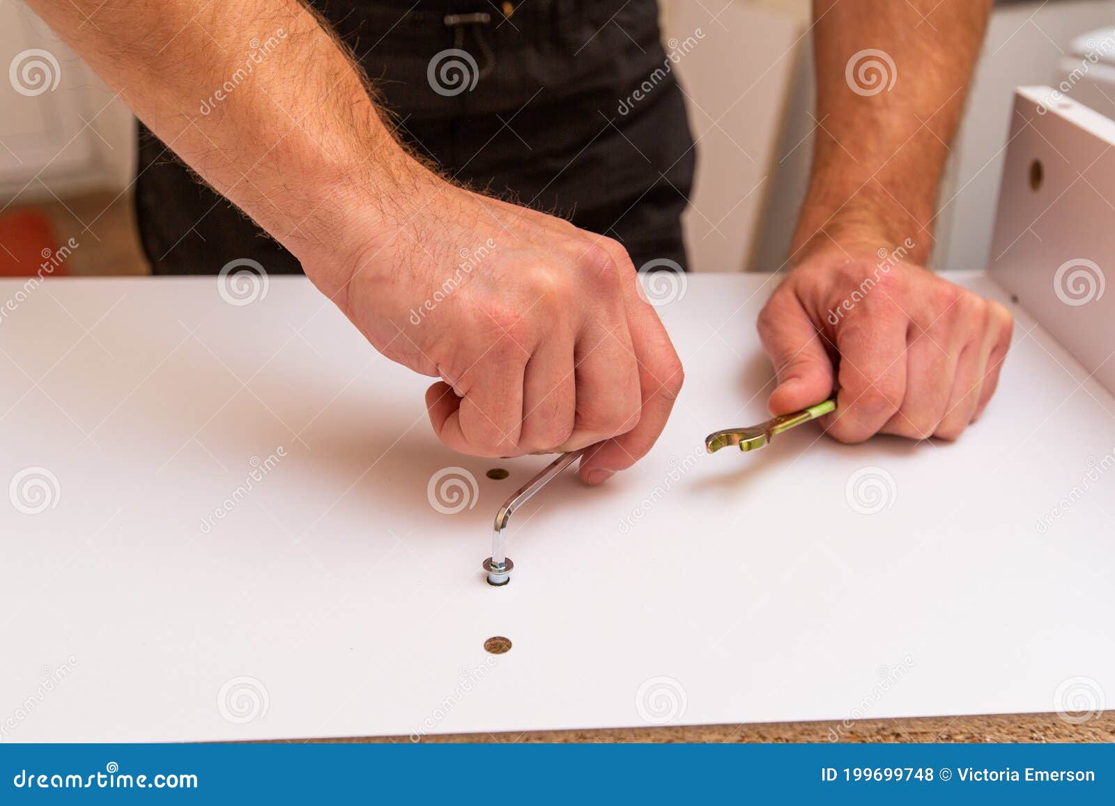 Screwing a into a Chipboard Stock Photo Image of male, home 199699748