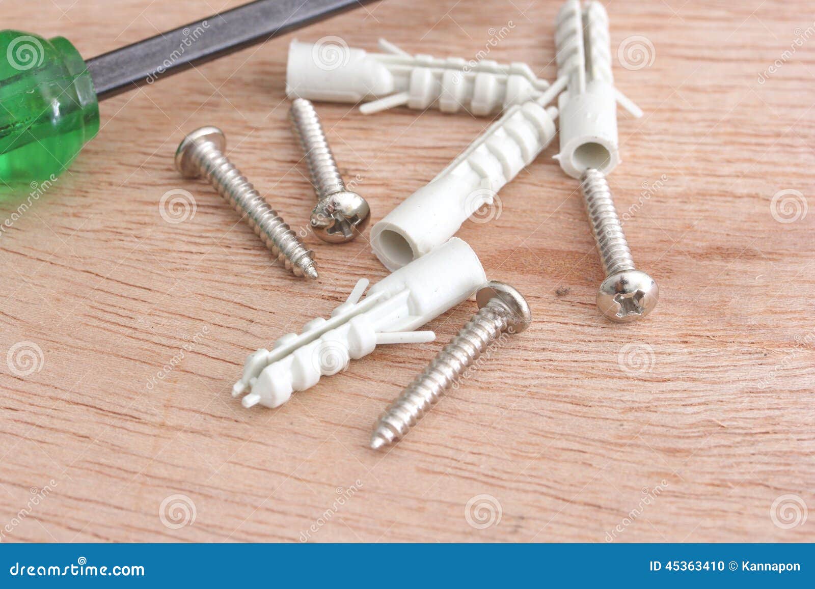 Screws and plastic anchor stock photo. Image of steel 45363410