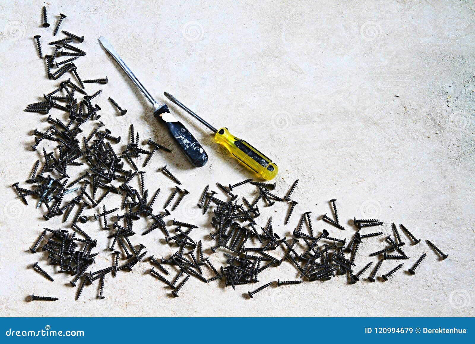 Screws and Screwdrivers on a Concrete Floor Stock Image Image of