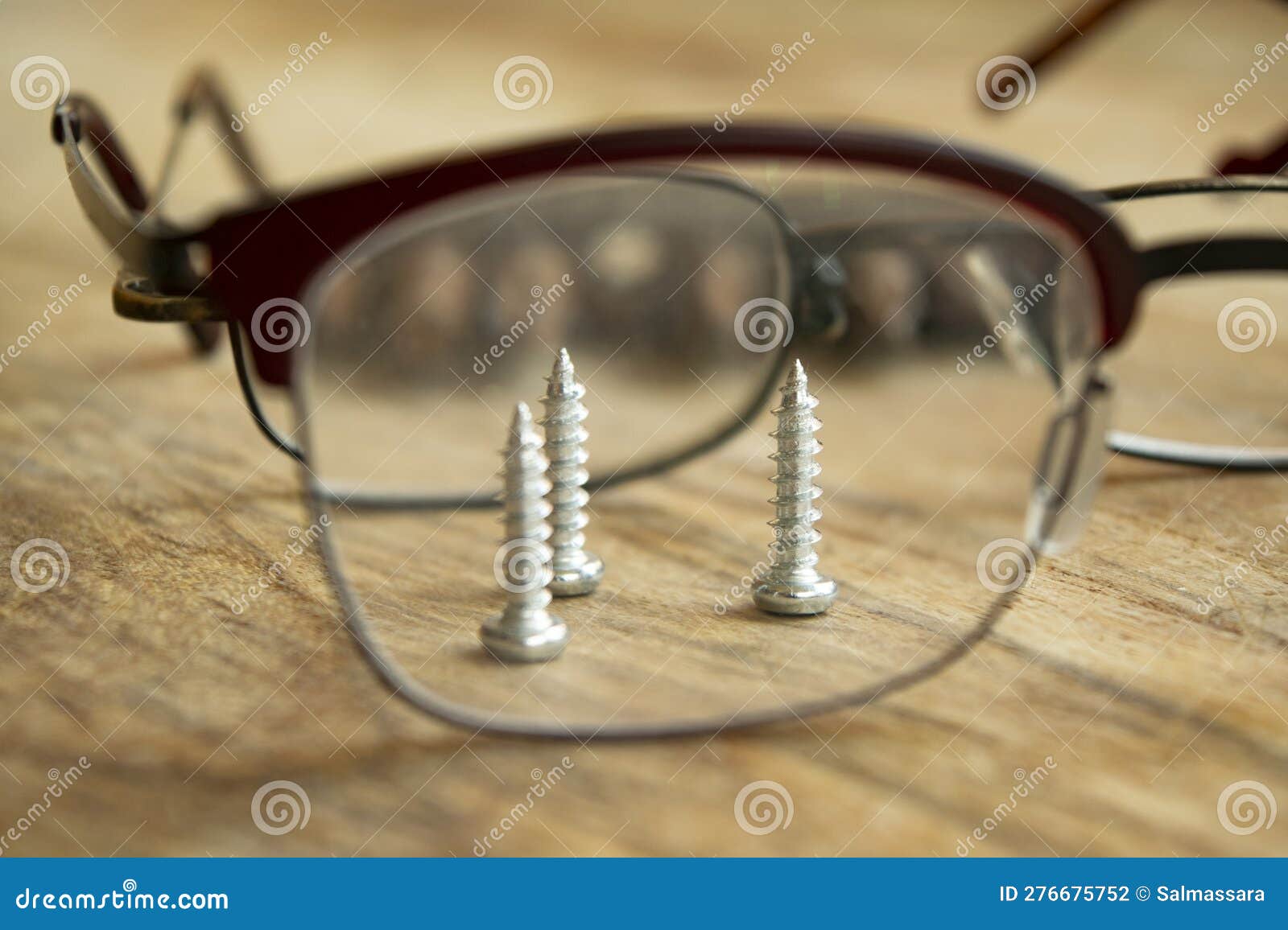 Screws Seen through Eyeglass Stock Photo Image of three, lens 276675752