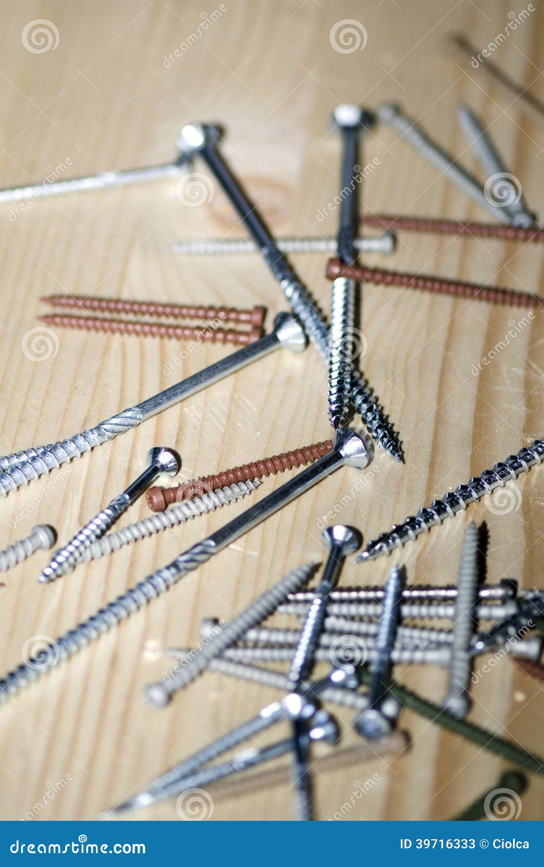 Screws on a wooden table stock image. Image of panel 39716333