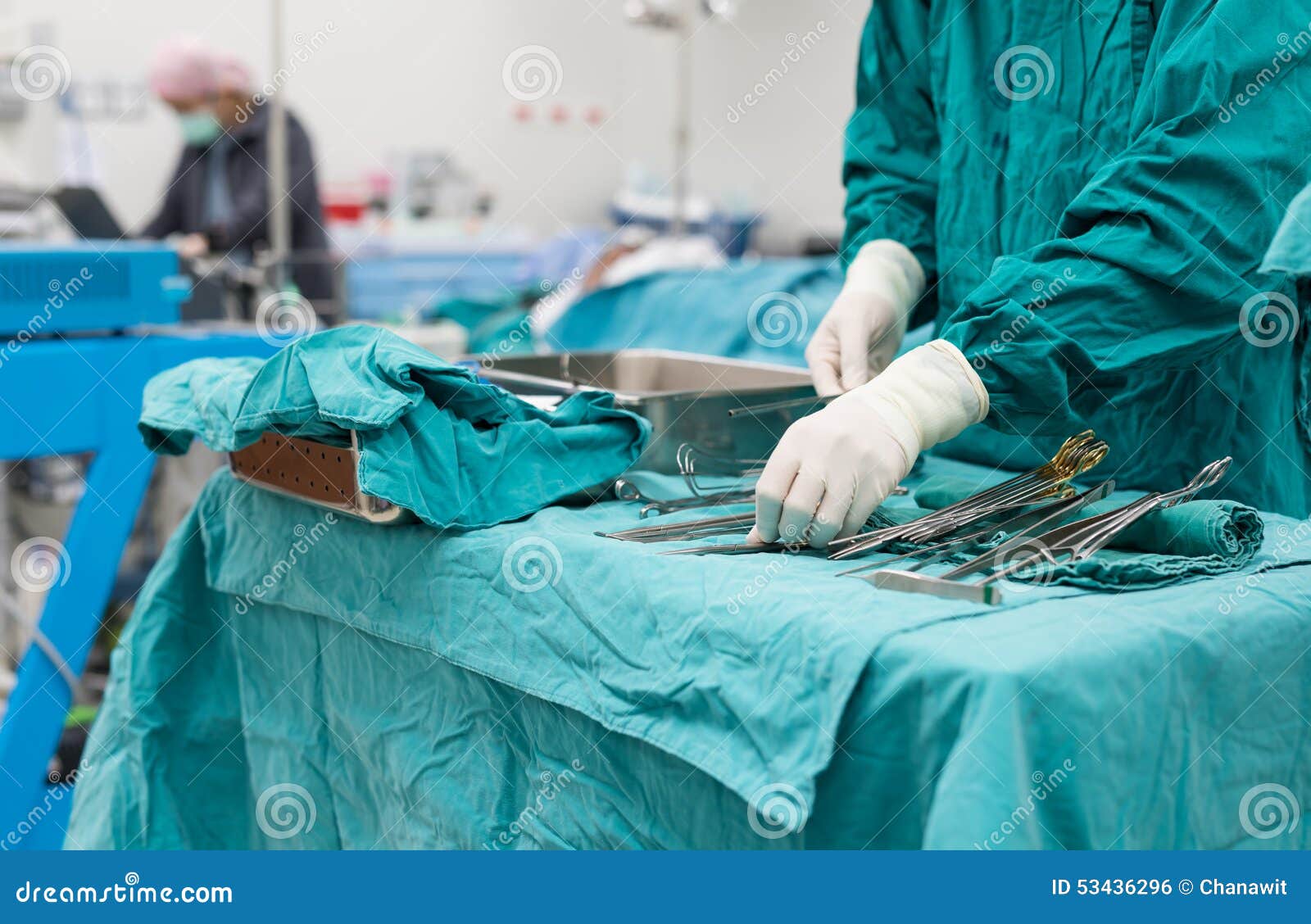 Scrub Nurse Preparing Medical Instruments for Operation Stock Photo