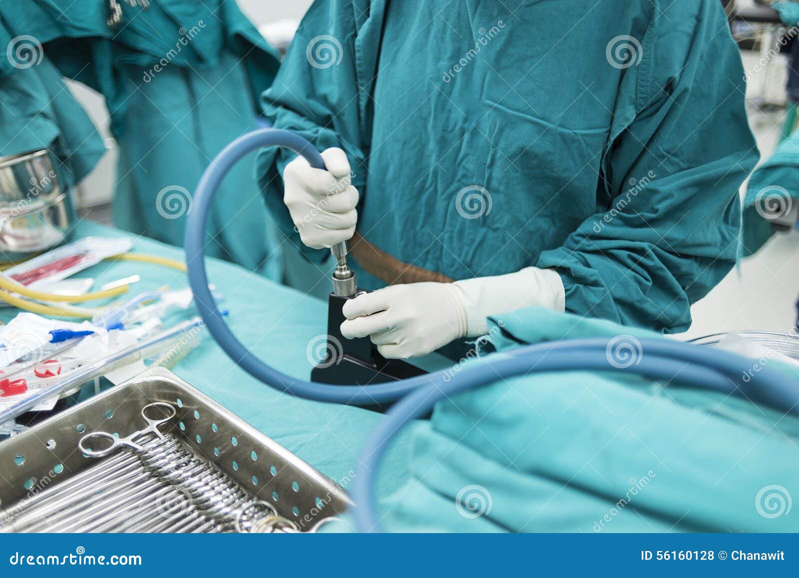 Scrub Nurse Preparing Medical Instruments for Surgery Stock Photo
