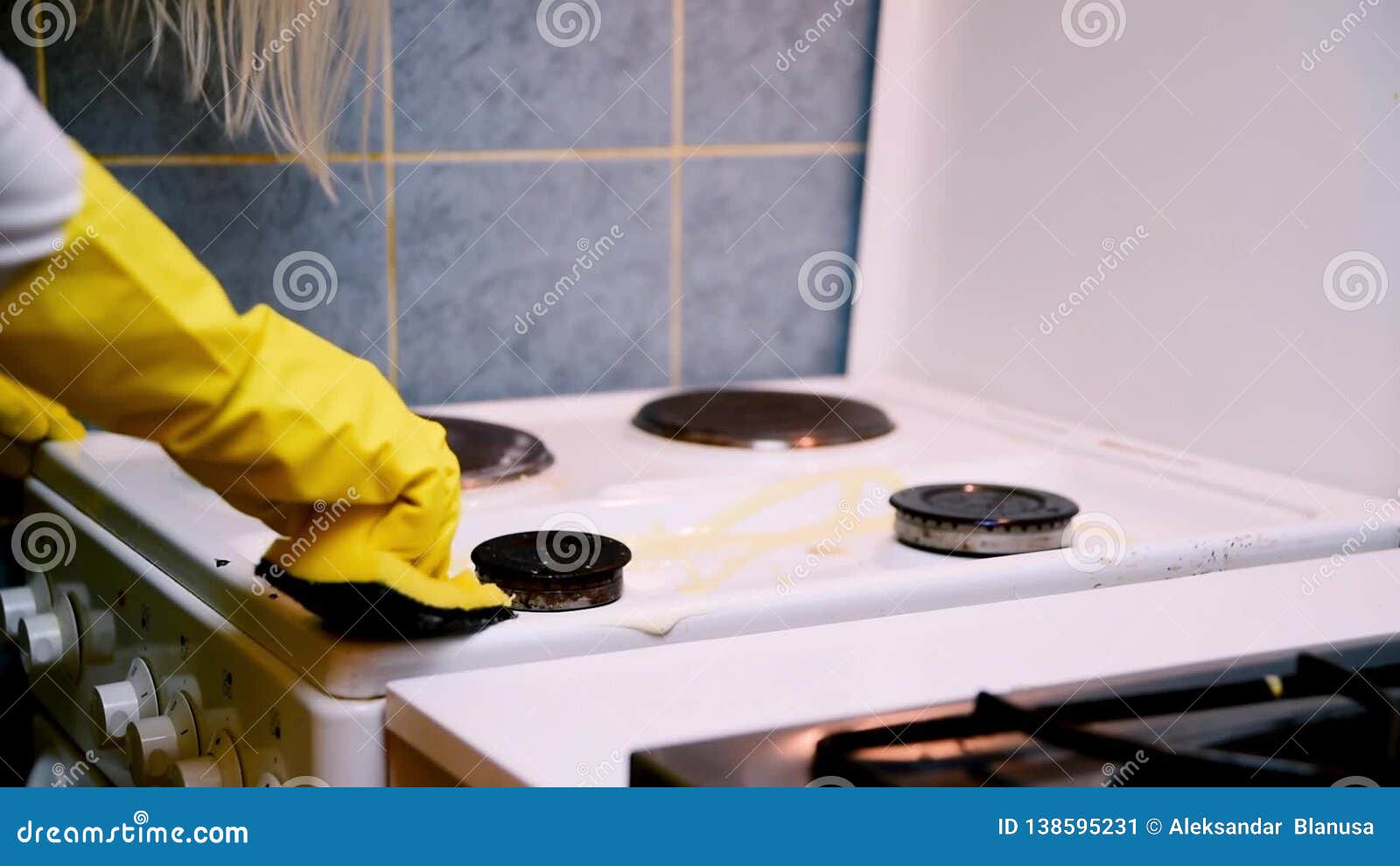 Scrubbing the Stove in the Kitchen with a Cloth Stock Video Video of