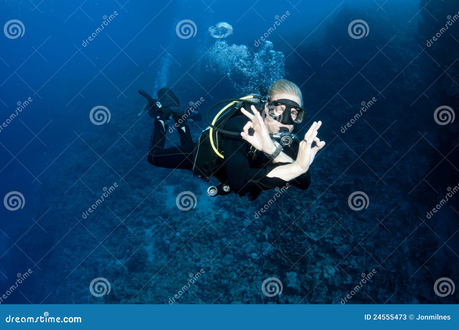 Scuba diver gives OK sign stock image. Image of woman 24555473