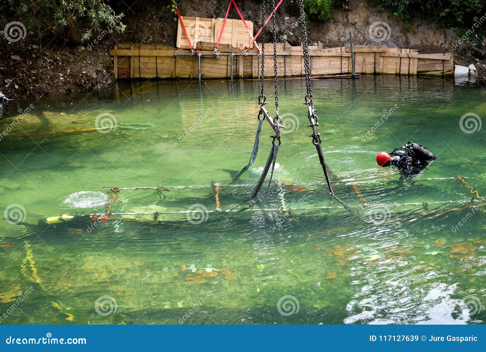 scuba diver worker is over viewing underwater archaeology works.