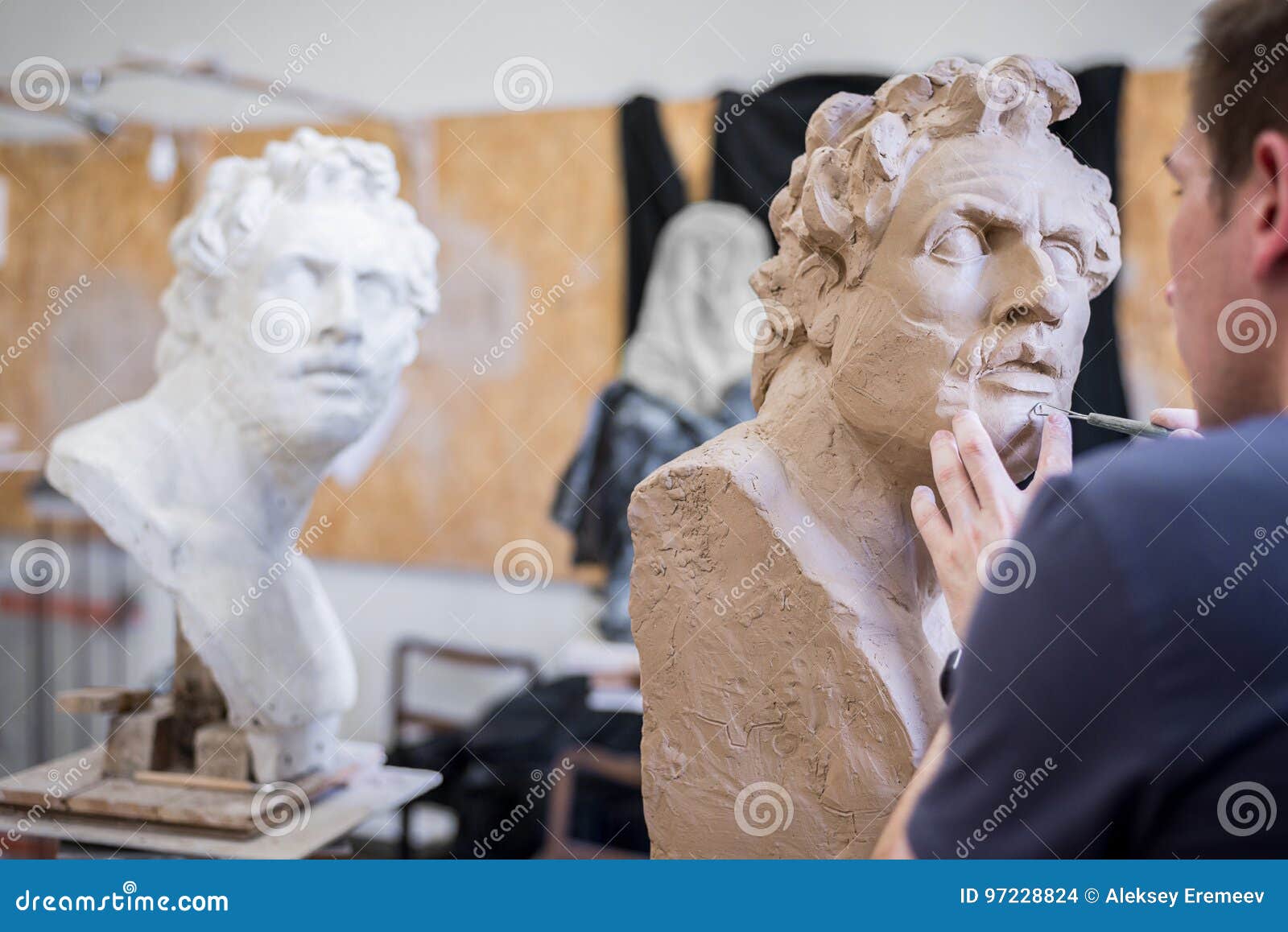 A Sculptor Sculpts a Sculpture of a Person`s Face. Horizontal Frame
